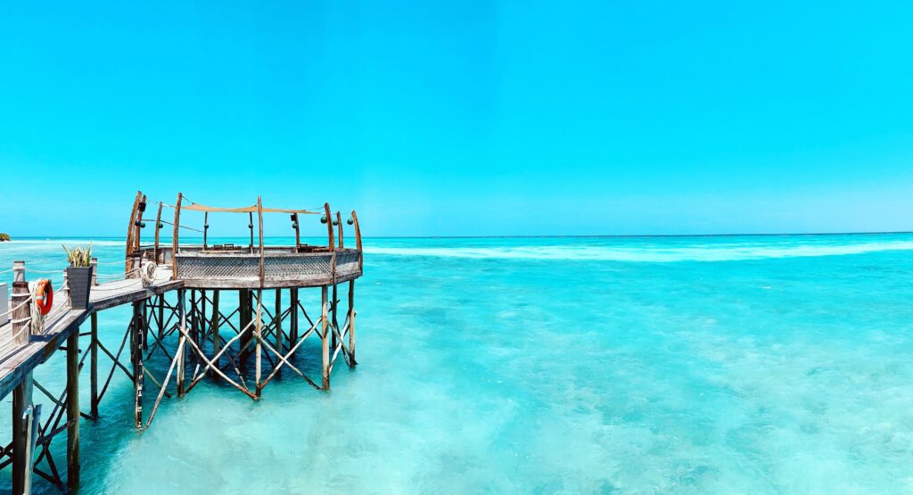 Beautiful calm, turquoise water surrounding a pier off the island of Zanzibar.